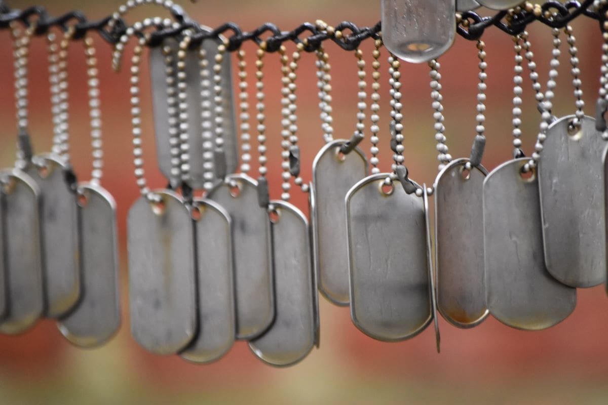 Military dog tags representing the loss of life due to war