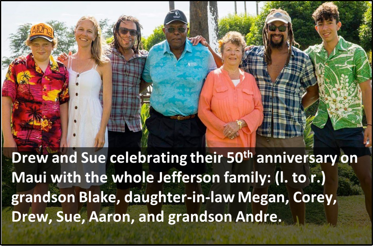 Family celebrating a 50th anniversary together in a garden setting.